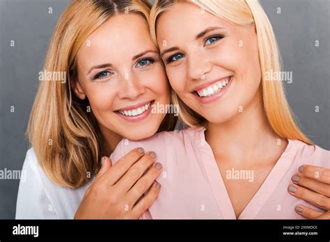 Proud Of Her Daughter Cheerful Mature Woman Embracing Her Daughter