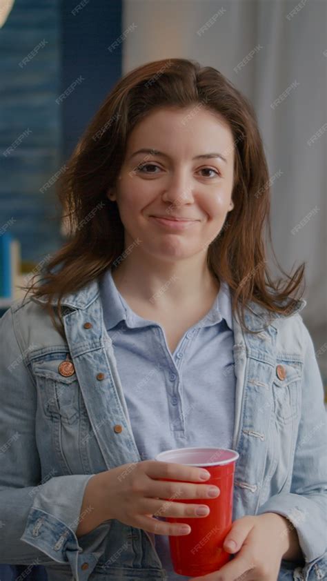 Premium Photo Portrait Of Beautiful Woman Holding Beer Glass Looking