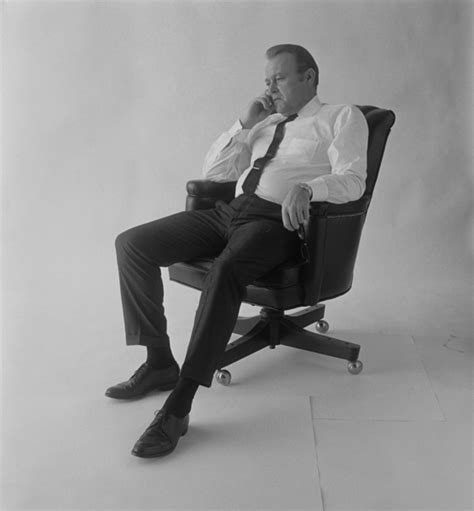 Mature Adult Man Sitting On Office Chair Against White Background Free