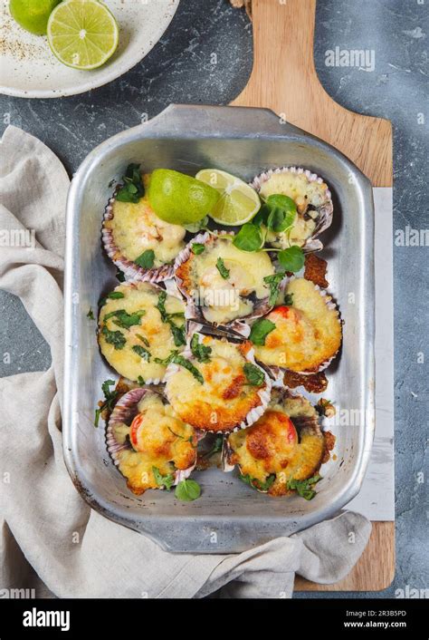 Baked ostiones with cheese Stock Photo - Alamy
