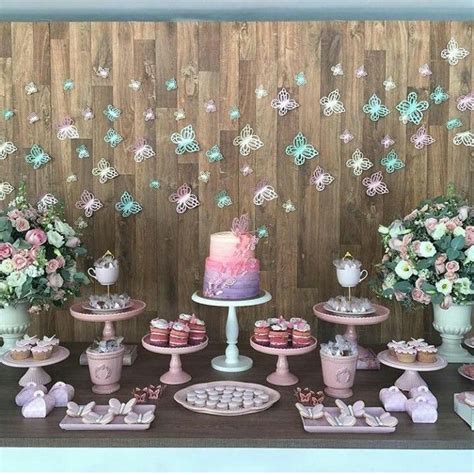 A Table Topped With Lots Of Cakes And Cupcakes