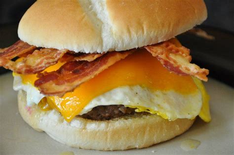 Yummy Angus Burger Crisp Bacon Cheddar Cheese And Fried Egg On A Garlic Buttered Bun