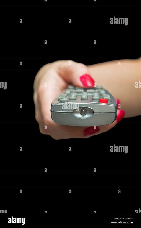 Woman S Hand Holding TV Remote Control Stock Photo Alamy