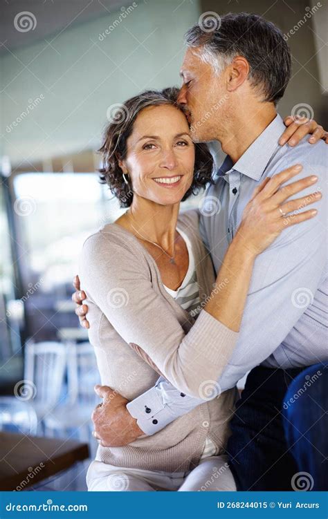 Love And Be Loved In Return An Affectionate Mature Couple Sitting In