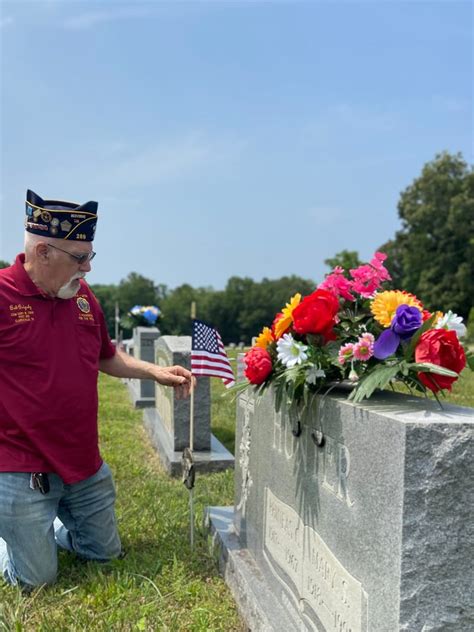 Bob Grigsby Placing A Flag American Legion CSM Gary M Crisp Post 289