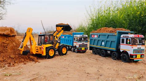 Jcb Cx Backhoe Loading Mud In Tata Truck And Tata Tipper Truck