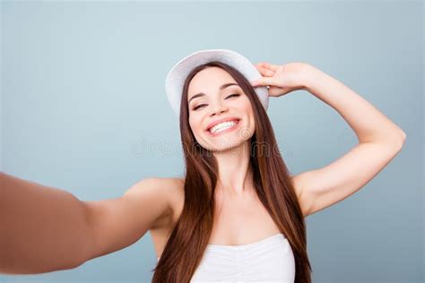 Young Cheerful Attractive Toothy Brown Haired Lady Is Smiling On Stock