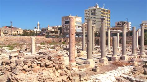 TYRE, LEBANON CIRCA 2013 - The Roman Ruins Of Tyre With The Modern City ...