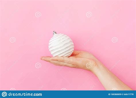 Simply Minimal Design Female Woman Hand Holding Christmas Ornament Ball