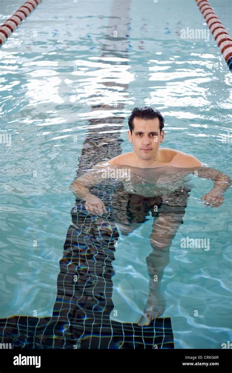 Man treading water in swimming pool Stock Photo - Alamy