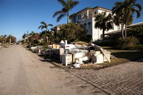 News Debris Including Personal Items Alongside Flooded Homes After