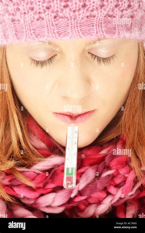 Blonde Woman Taking Her Temperature Stock Photo Alamy