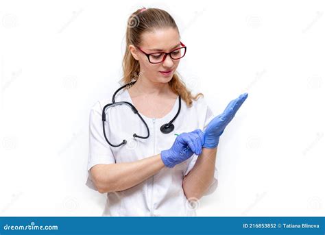 Female Doctor In White Coat With Stethoscope Puts On Gloves Isolated