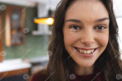 Portrait Of Happy Caucasian Woman With Long Brown Hair Smiling In