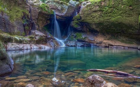 Waterfall From Green Algae Covered Rocks Pouring On Lake With Stones Hd Nature Wallpapers Hd