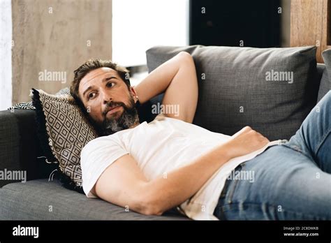 Mature Man Lying On Couch Relaxing Stock Photo Alamy