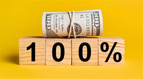 100 Interest With Money On A Yellow Background The Concept Of Business