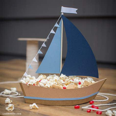 Ship Party Snacks with This DIY Paper Sailboat Centerpiece!