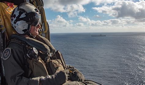 Naval Aircrewman Sits Aboard An MH 60S Sea Hawk Helicopter Flickr