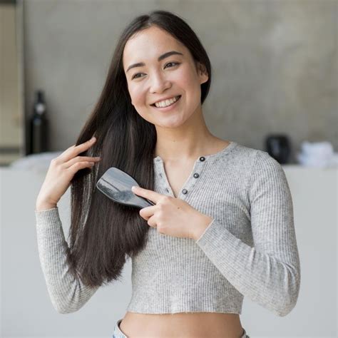 Stunning Portrait Of A Woman Brushing Her Hair