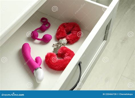Different Modern Sex Toys In Open Wooden Drawer Stock Photo Image Of