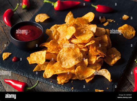 Hot Spicy Sriracha Potato Chips Ready To Eat Stock Photo Alamy