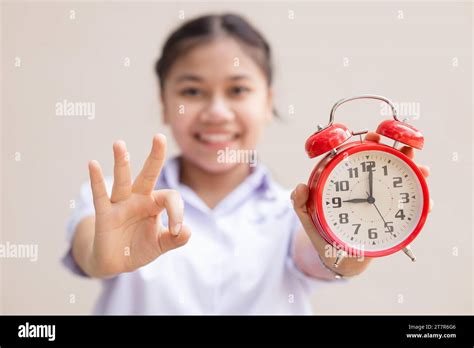 Teen Girl Student With Alarm Time Clock For Ready Education Times Back