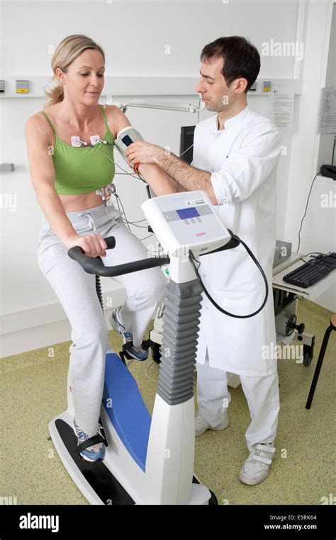 Female Patient Doing Monitored Heart Rehabilitation Training Exercises