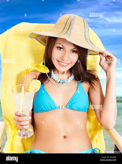 Woman In Bikini Drinking Alcohol Cocktail Through A Straw Stock Photo