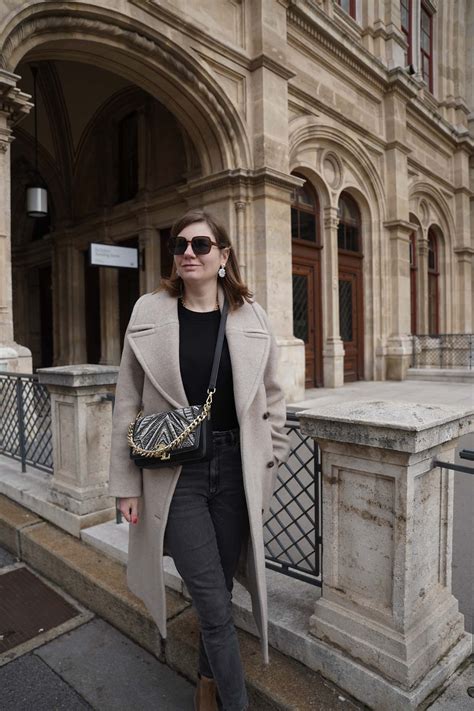 Winter Outfit In Vienna Sézane Winter Coat Jeans And Black Sweater