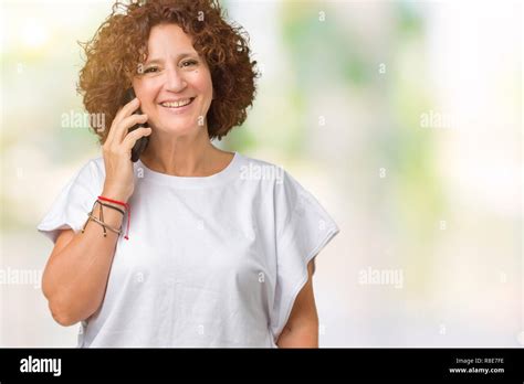 Middle Ager Senior Woman Talking On Smartphone Over Isolated Background