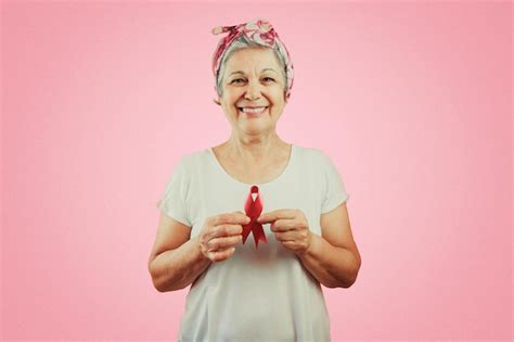 Premium Photo Mature Woman With Pink Ribbon Isolated For Breast