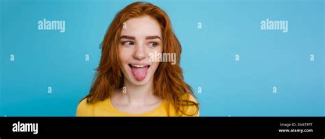 Headshot Portrait Of Happy Ginger Red Hair Girl With Funny Face Looking