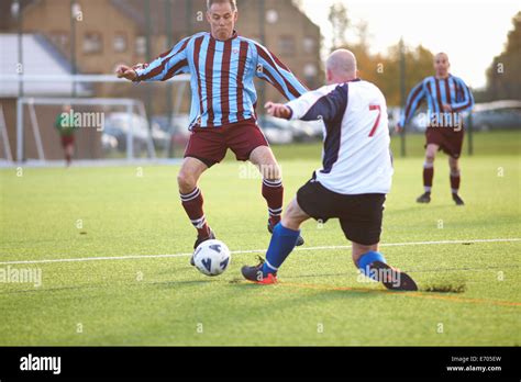 Football Players Fighting For Ball Stock Photo Alamy