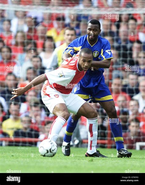 Arsenals Thierry Henry Front And Leeds Uniteds Lucas Radebe During