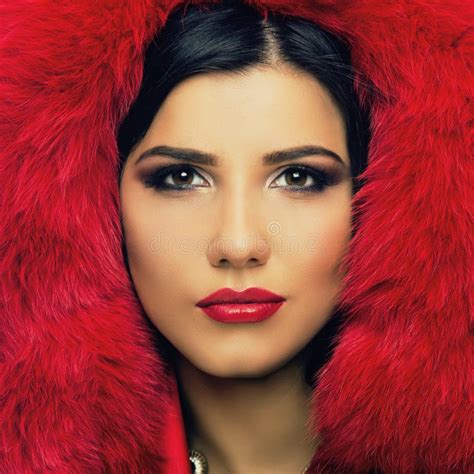 Portrait Of An Attractive Stylish Woman In A Red Fur Hat Stock Image