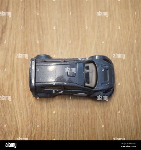The Top View Of A Ford Fiesta Mattel Hot Wheels Toy Car Model Made Of Metal On A Wooden Surface