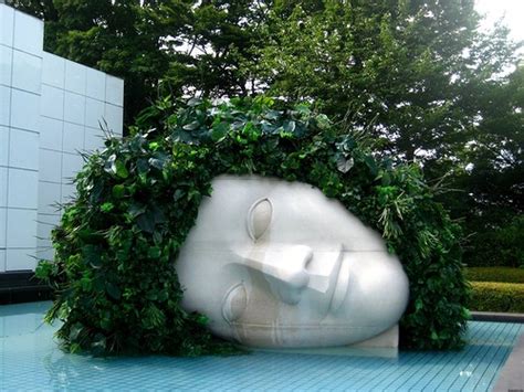 This sculpture of a horizontal head has turned into an artful flower ...
