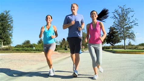 Three Fit Young People Keeping Fit Jogging Together Stock Footage Video