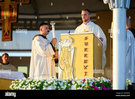 A Priest Reading The Gospel At Holy Mass At Mladifest 2024 The Annual