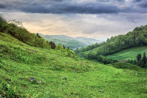 Village On Hillside Meadow With Forest In Mountain Free Photo Download