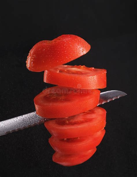 Red Tomato Cut With A Knife Into Pieces Levitation Stock Photo Image