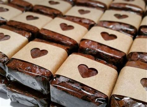 Many Brownies Are Wrapped In Brown Paper With Hearts On Them