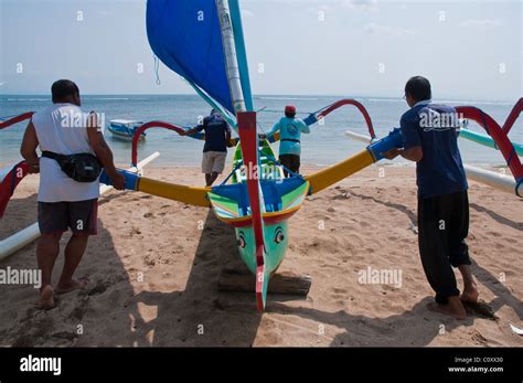 Brightly Coloured Balinese Outrigger Fishing Boat Called A Jukung On