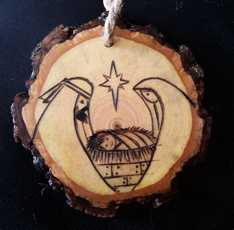 This Rustic Nativity Ornament Made From A Slice Of A Hickory Branch