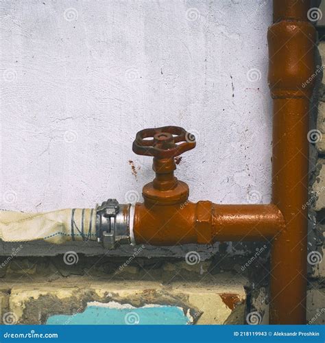 Fire Hydrant With A Connected Hose Indoors Against Stock Image Image