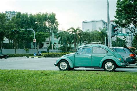 Hd Wallpaper Teal Volkswagen Beetle Parked On Gray Concrete Road