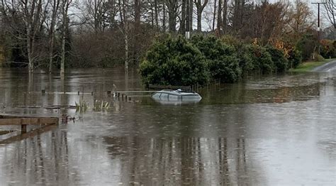 Line Workers Rescue Motorist Trapped In Rising Floodwaters