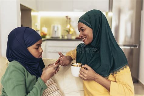 Muslim Mother And Daughter Spending Quality Time Together At Home Stock