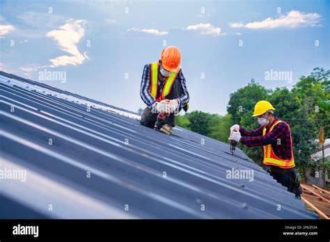 Team Work Roof Concept Of Residential Building Under Construction